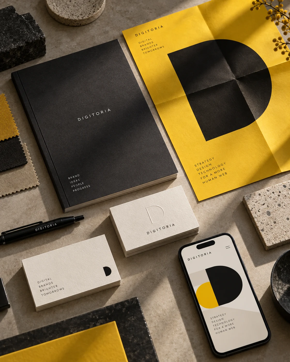 Digitoria stationery and brand details in charcoal, ivory and yellow